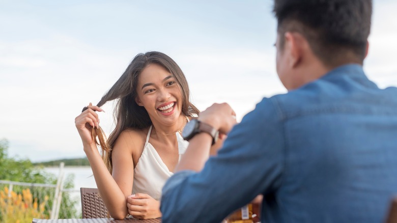 A woman twirling her hair