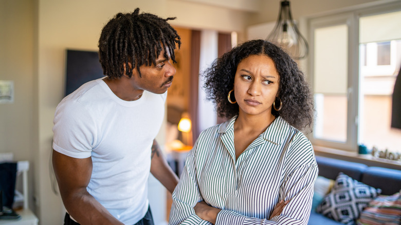 man talking to upset woman