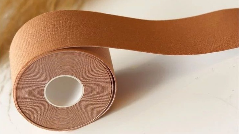 Tan boob tape roll