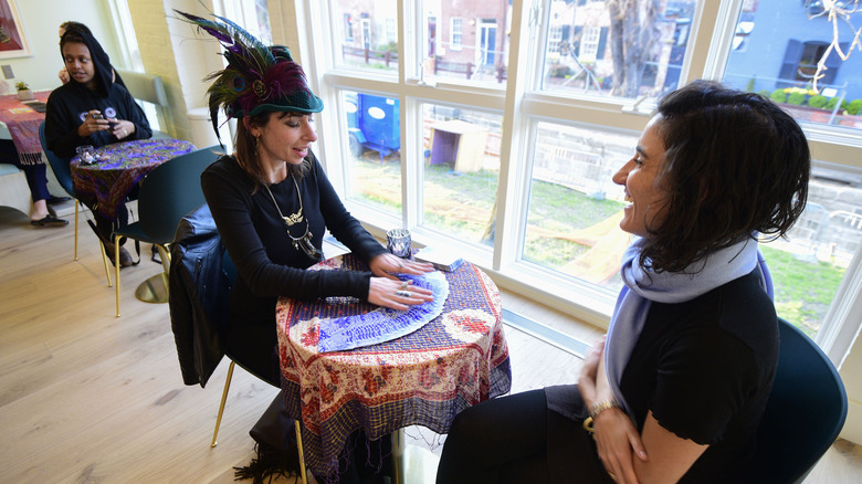 Woman getting tarot reading