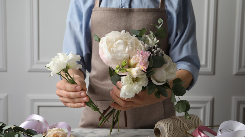 Man arranging flowers