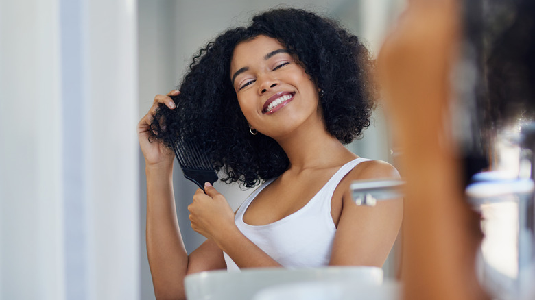 A woman combing her hair