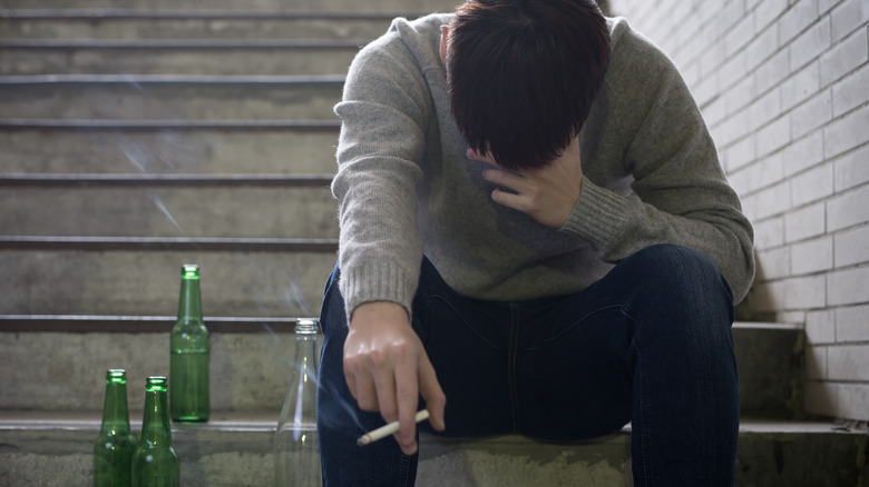 man struggling with cigarette addiction