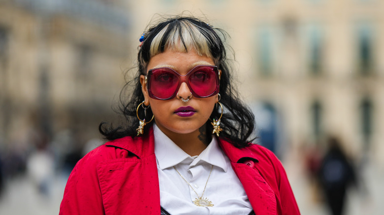 woman with curly hair, straight bangs