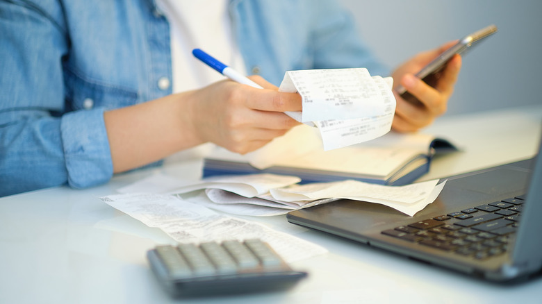 Woman calculates budget