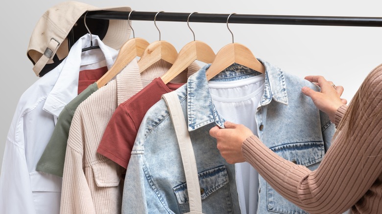 woman selecting clothes off the rack