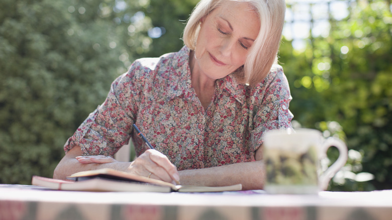 Woman writing in journal