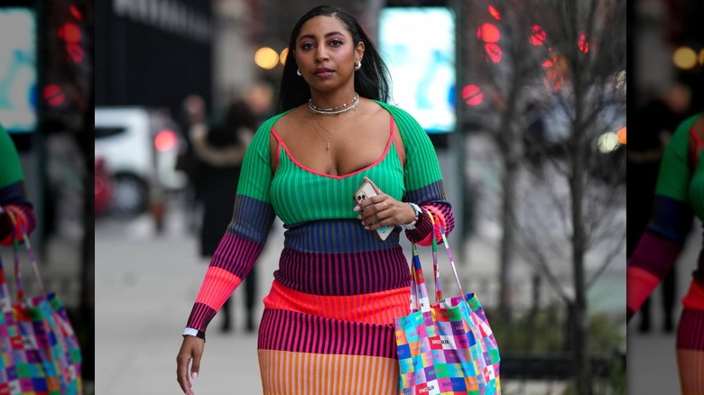 Woman with multicolored dress and boots