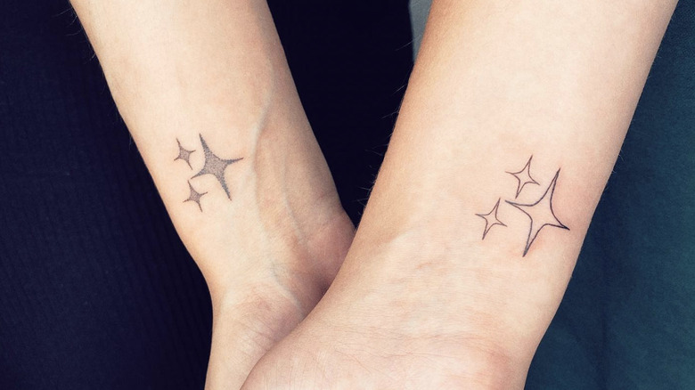 matching star tattoos