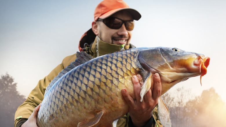 man holding fish