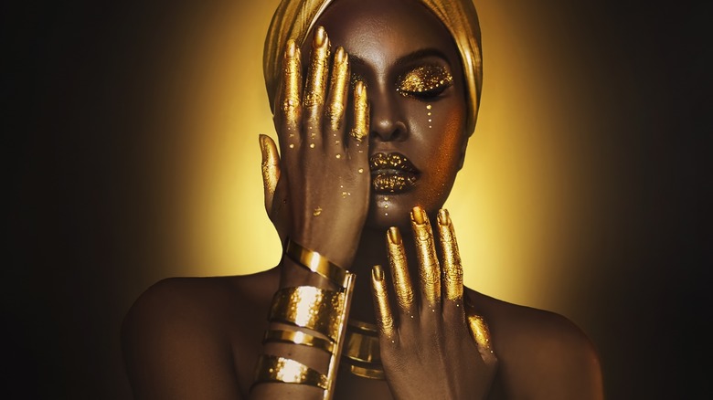 Woman covered in gold jewelry