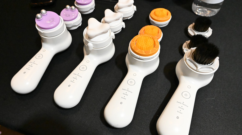 clarisonic devices on a black table
