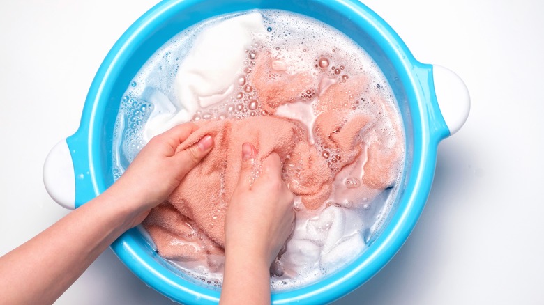 Person hand-washing clothes