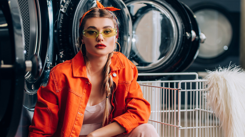 Woman preparing to wash faux garment