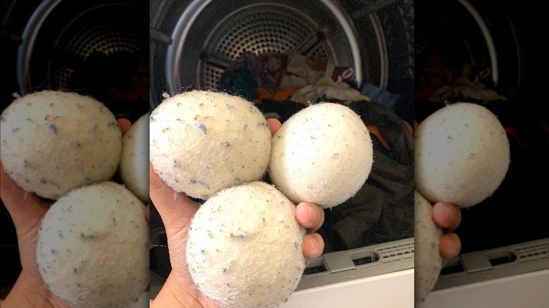 person showing wool dryer balls