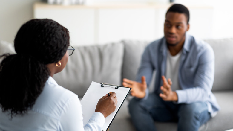 man talking to a female therapist