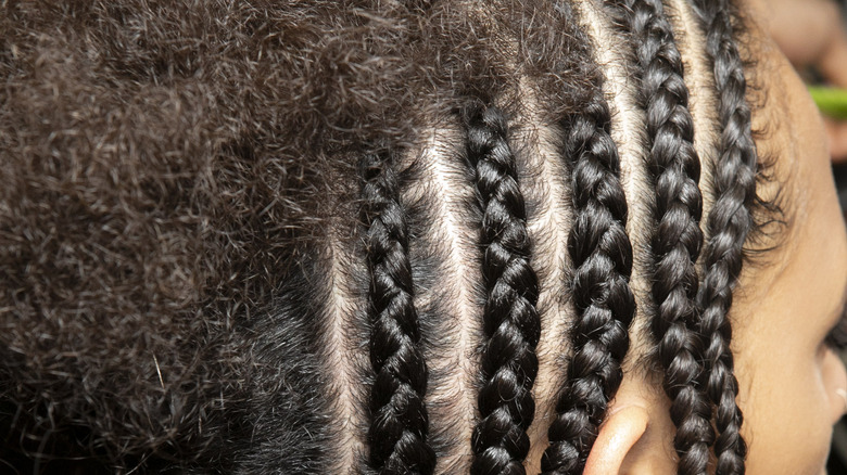 cornrows and unfinished portion of hair