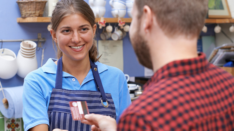 a barrista smiling at a customer