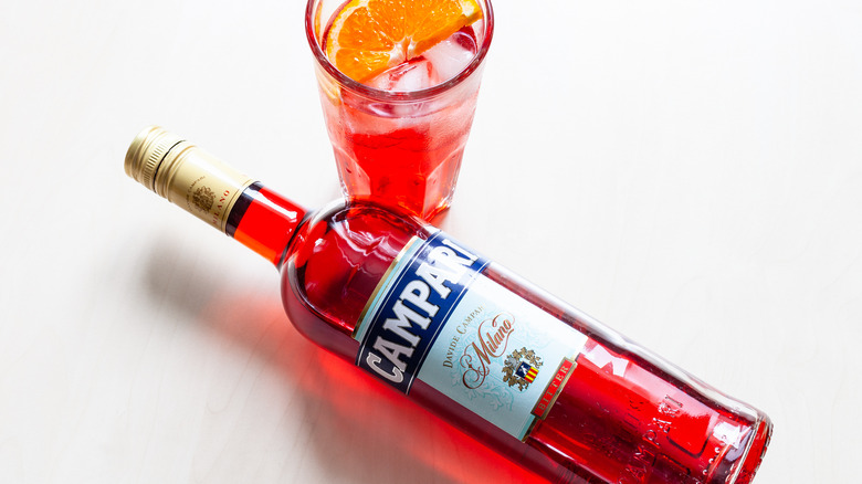 Bottle of Campari with glass