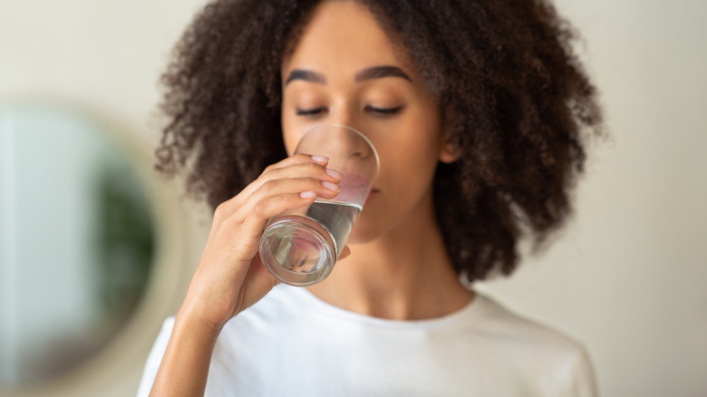african american woman drinking water