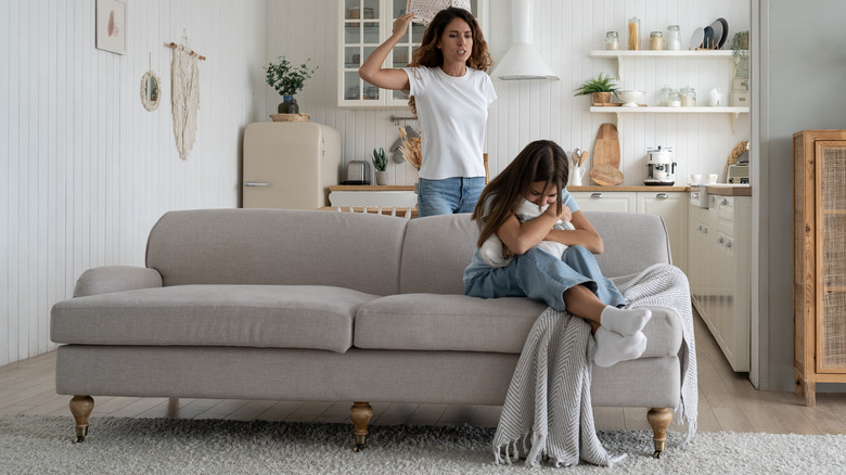 Mother yelling at crying daughter 