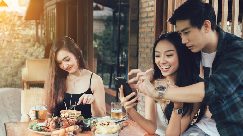 Woman feeling like third wheel