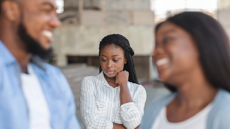 Woman feeling like third wheel