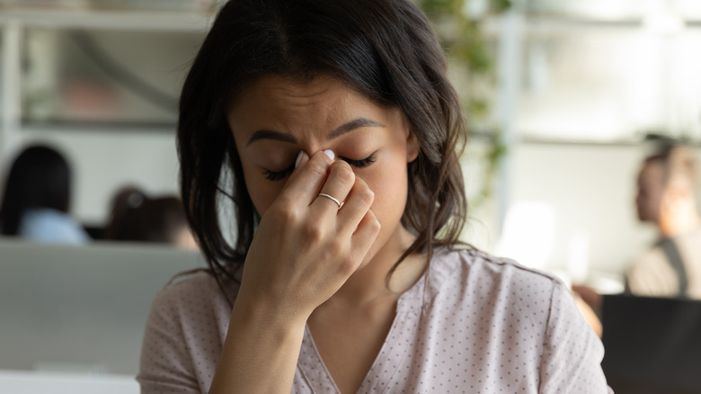 Black woman tired and frustrated at work