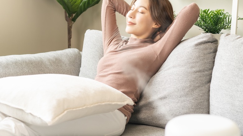 woman enjoying air purifier