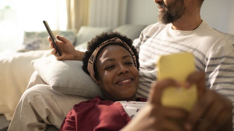 couple looking at phones