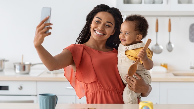 mom taking a selfie with her baby 