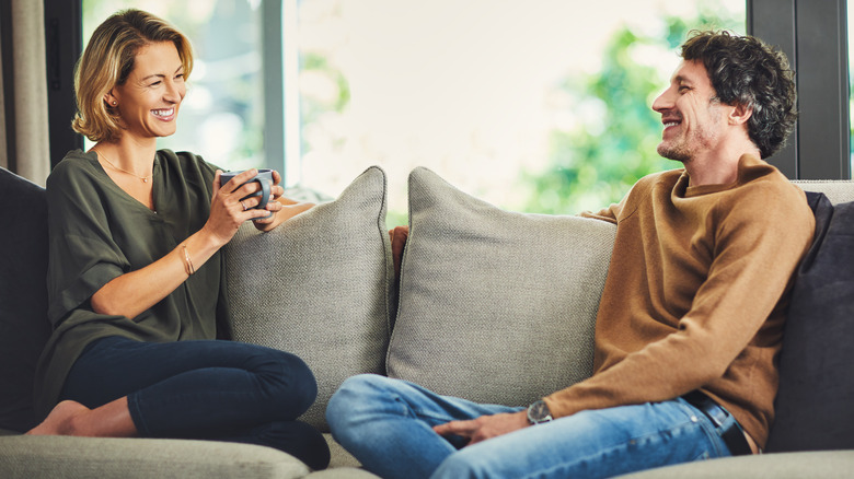 couple talking on a sofa