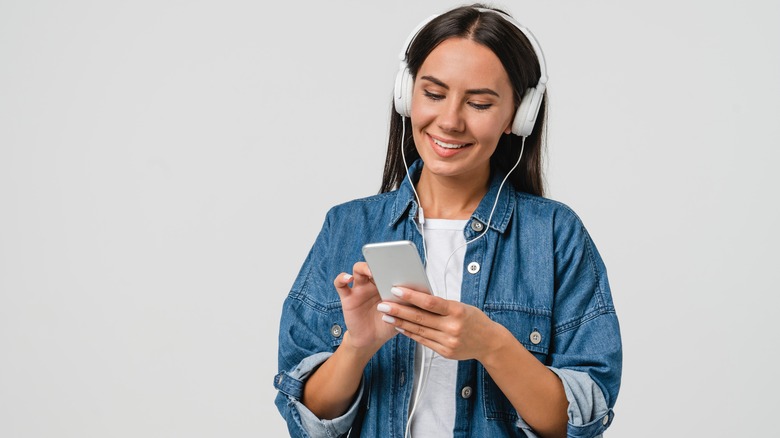 woman listening to headphones