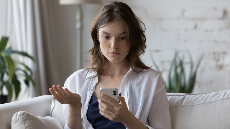 Woman shocked on her phone