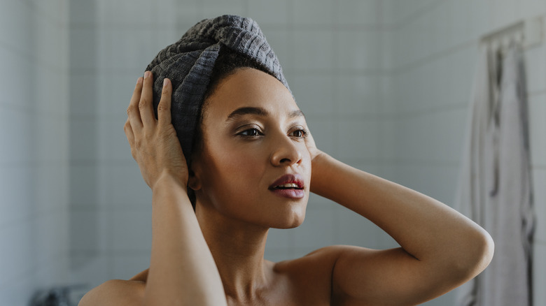 woman with wrapped hair in bathroom