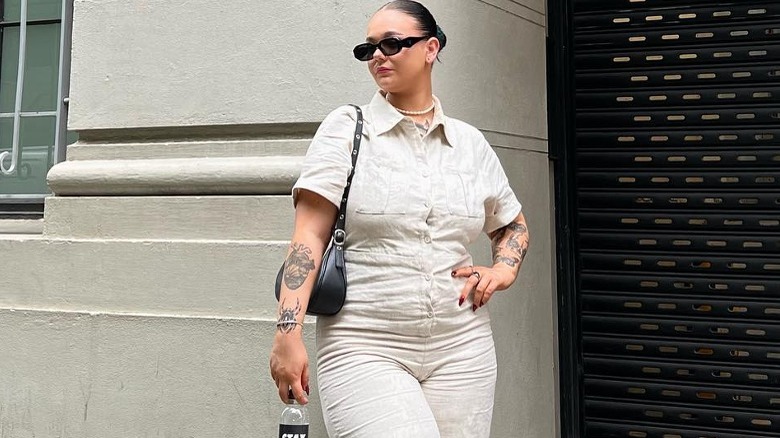 Person wearing a beige jumpsuit