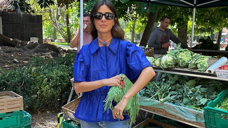 Person in cobalt blue blouse