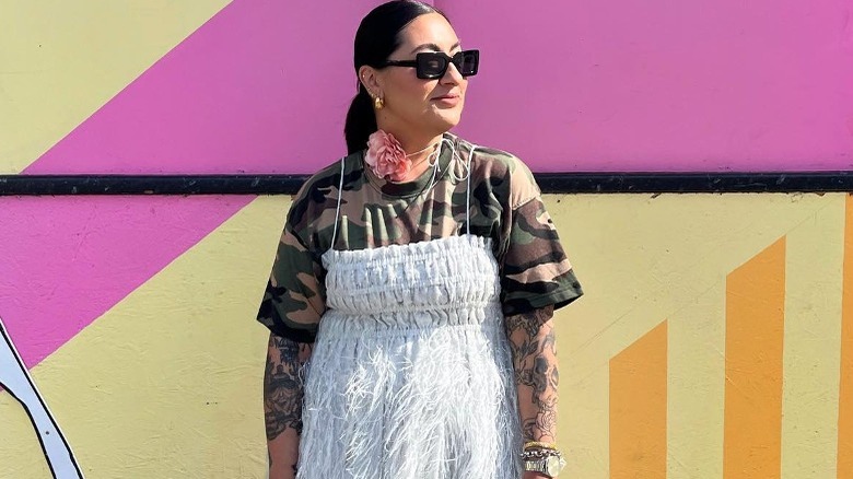 Person wearing a T-shirt under a dress