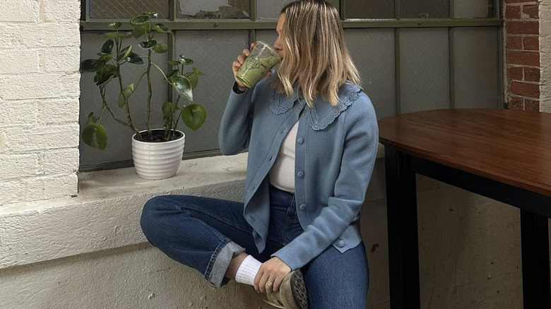 Woman sipping healthy smoothie