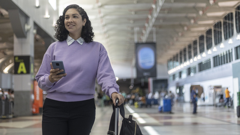 Woman traveling through airport