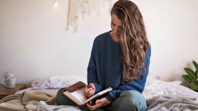 Woman writing in journal