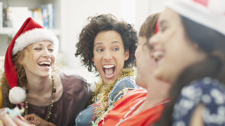 Friends laughing during the holidays