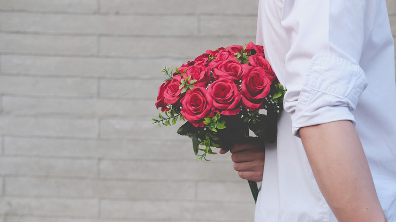 Person bringing flowers 