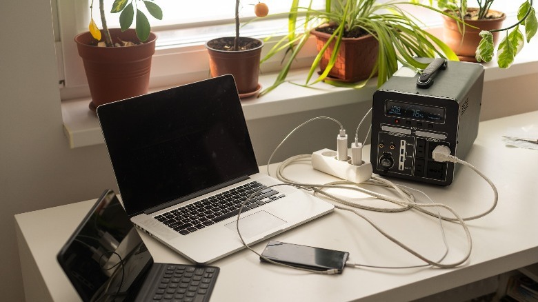 Desk with multiple electronic devices