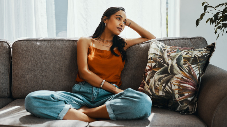 woman thinking on sofa