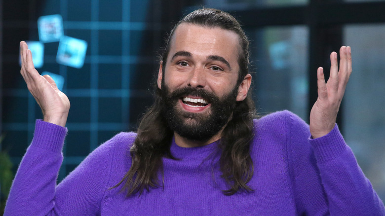 Jonathan Van Ness smiling and shrugging