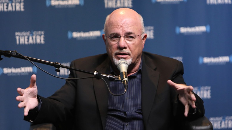 Dave Ramsey speaking into microphone