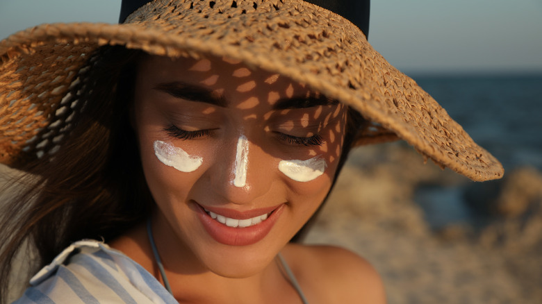 woman with sunscreen on face