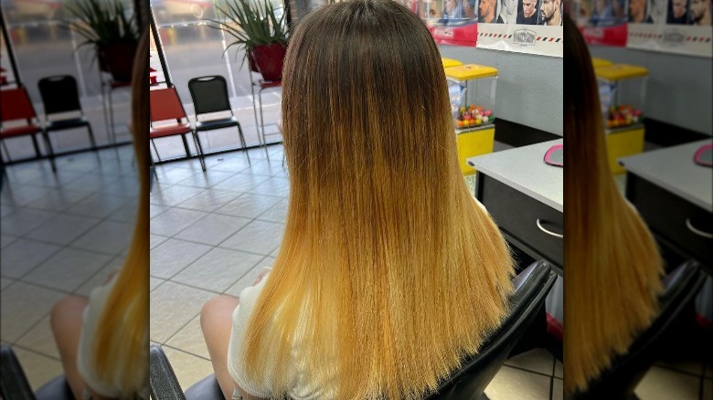 woman in chair lightening hair