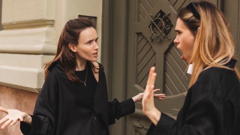 Two women arguing outside